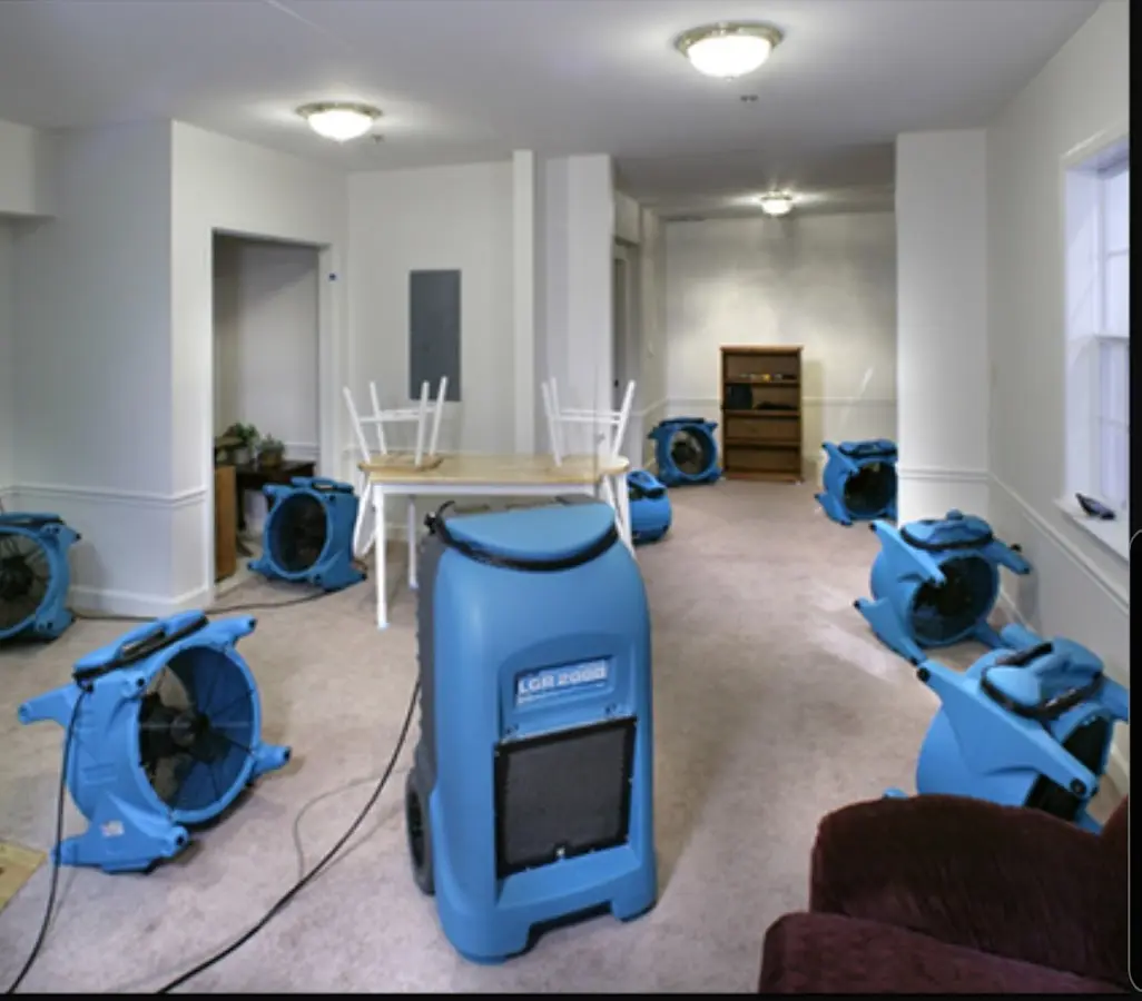 Air movers and dehumidifier setup for Water Damage Restoration in Borger